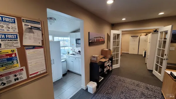 a view of room with workspace and windows