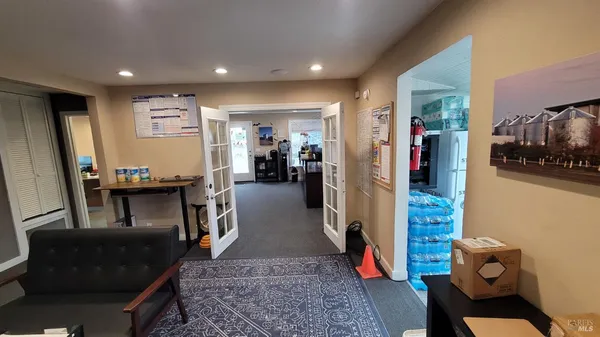 a view of a hallway with workspace