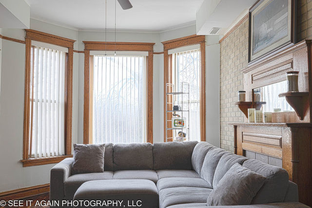5942 South Calumet Avenue, Unit 2 Chicago, IL 60637 - Photo 2 of 3 a living room with furniture and a large window