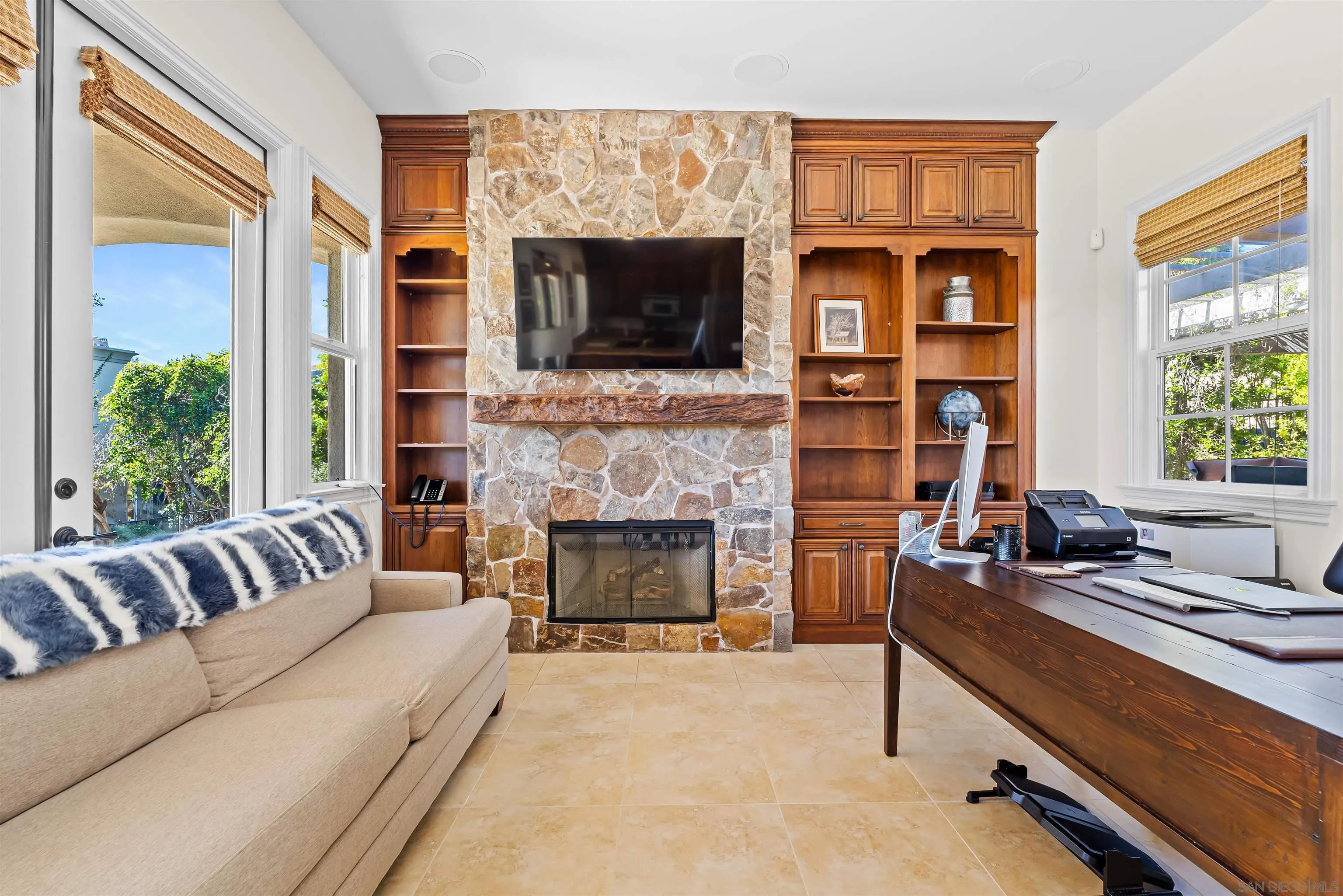 301 Cantle Lane Encinitas, CA 92024 - Photo 63 of 75 a living room with furniture flat screen tv and a fireplace