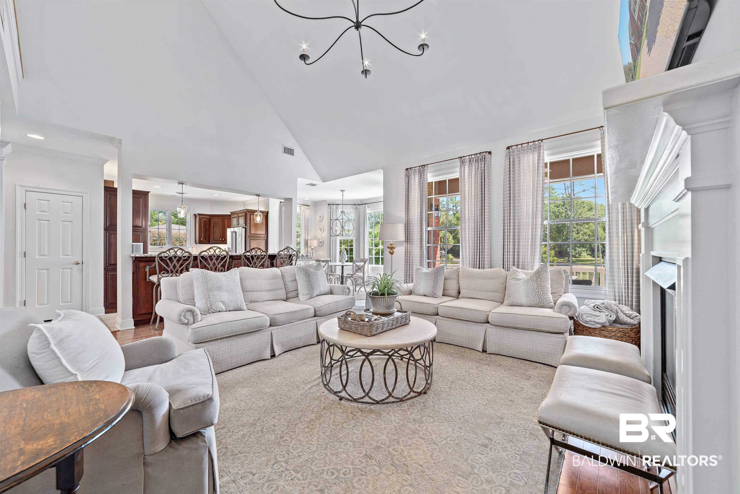 6630 East Quarry Drive Elberta, AL 36530 - Photo 5 of 63 Living room featuring high vaulted ceiling, a chandelier, and a fireplace