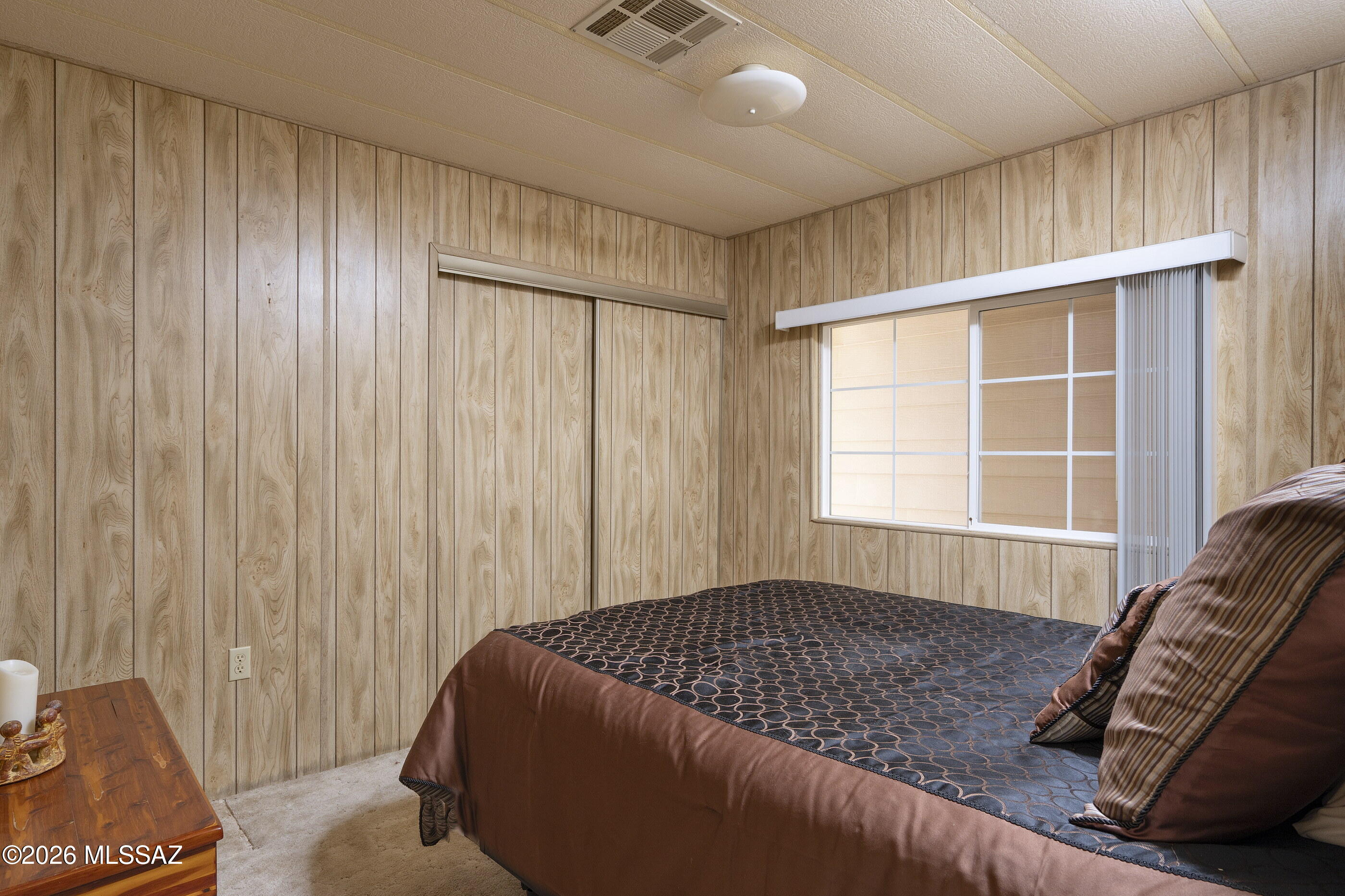 6121 West Flying M Street Tucson, AZ 85713 - Photo 15 of 25 a bedroom with a bed and a window