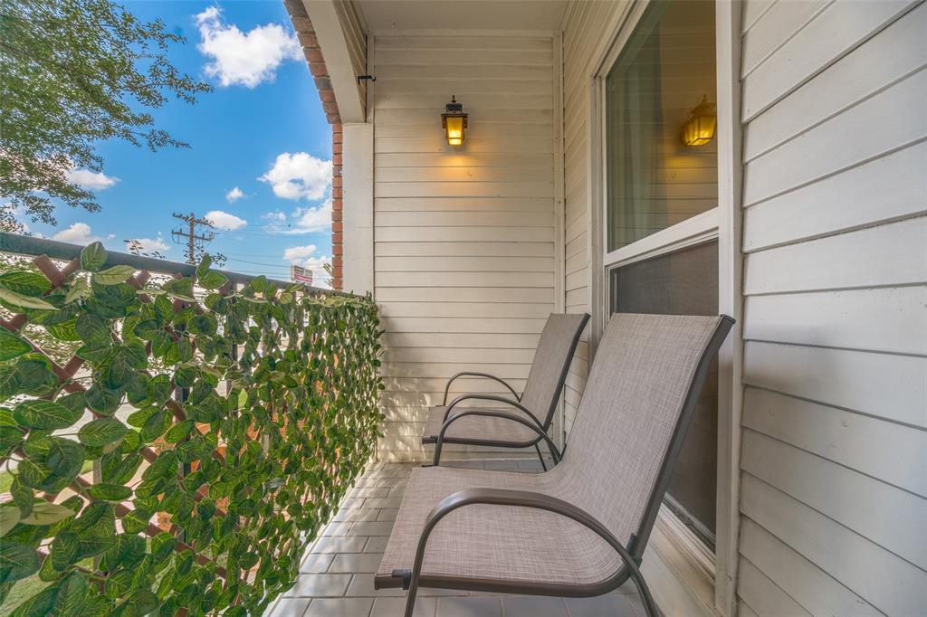 4034 Rawlins Street, Unit 104 Dallas, TX 75219 - Photo 16 of 19 a view of balcony with wooden floor and seating space