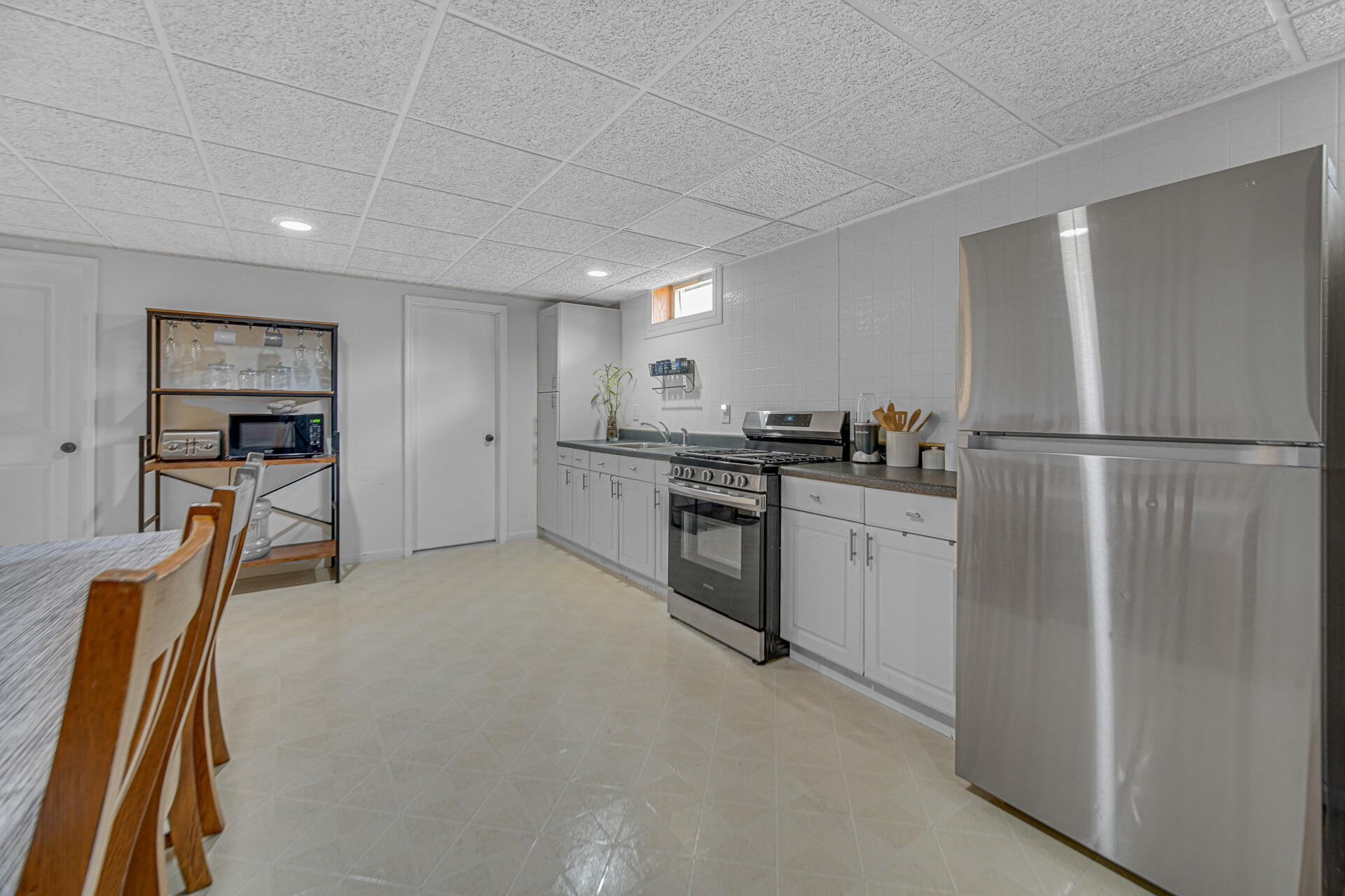 4942 West 93rd Court Crown Point, IN 46307 - Photo 20 of 37 a kitchen with refrigerator and cabinets