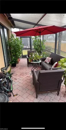 a view of swimming pool with outdoor seating