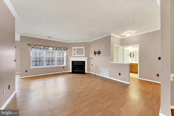 a balcony with furniture and wooden floor