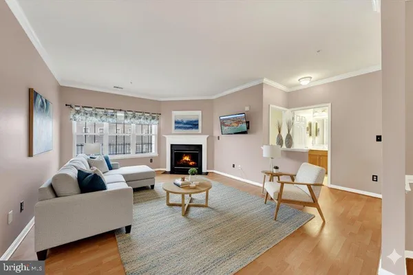 a spacious bedroom with a bed and a chandelier