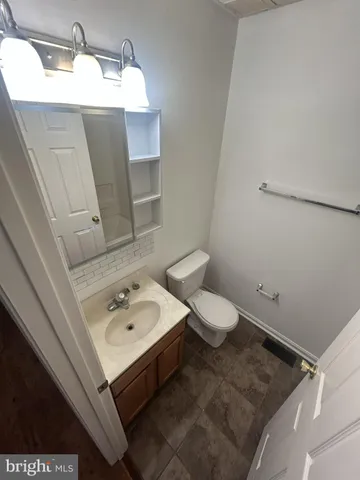 a bathroom with a sink and toilet