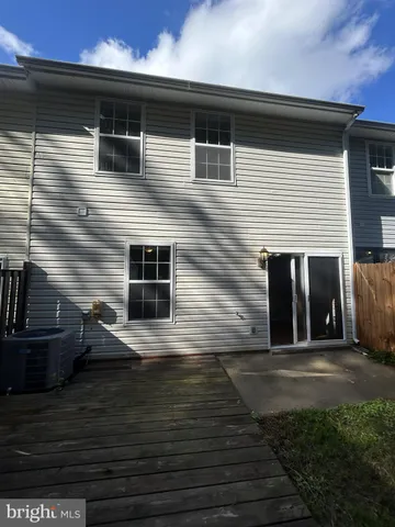 a front view of a house with stairs