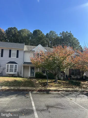 a view of a white house with a ocean view