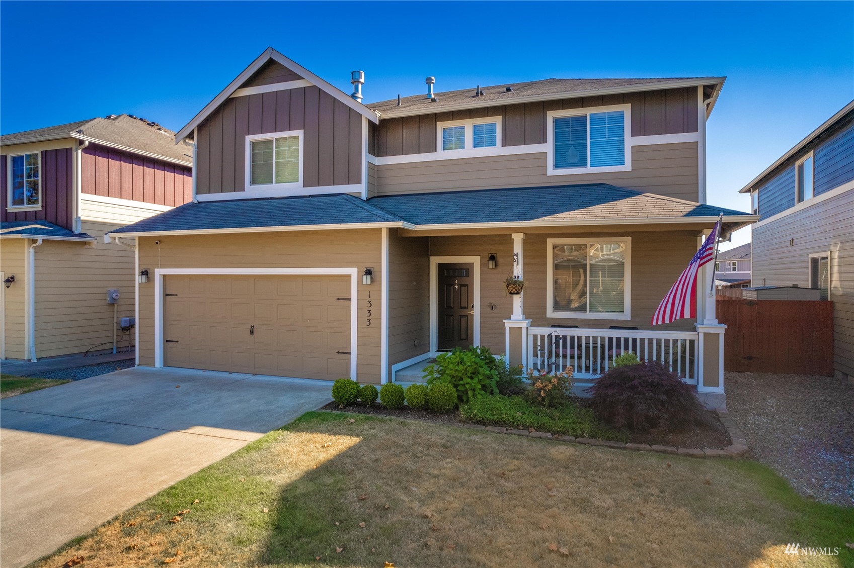 1333 Farina Loop Southeast Olympia, WA 98513 - Photo 1 of 32 a front view of a house with a yard