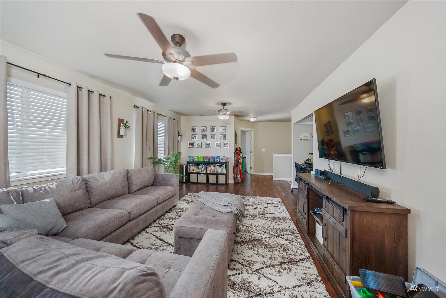 1333 Farina Loop Southeast Olympia, WA 98513 - Photo 21 of 32 a living room with furniture and a flat screen tv