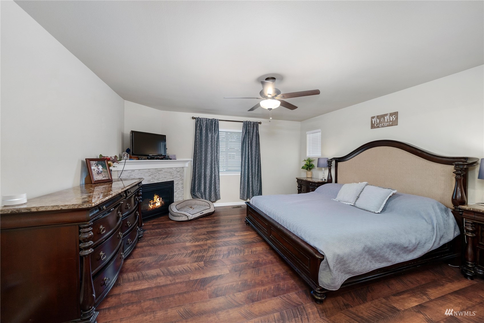 1333 Farina Loop Southeast Olympia, WA 98513 - Photo 26 of 32 a bedroom with a bed and a fireplace