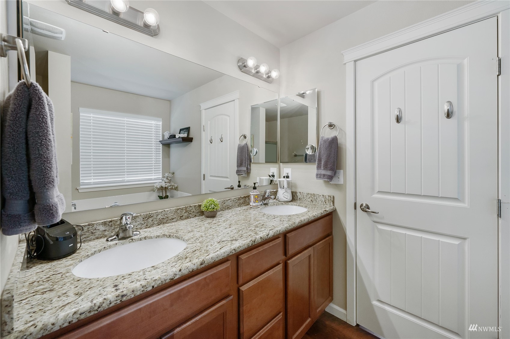 1333 Farina Loop Southeast Olympia, WA 98513 - Photo 28 of 32 a bathroom with a granite countertop double vanity sink and a mirror