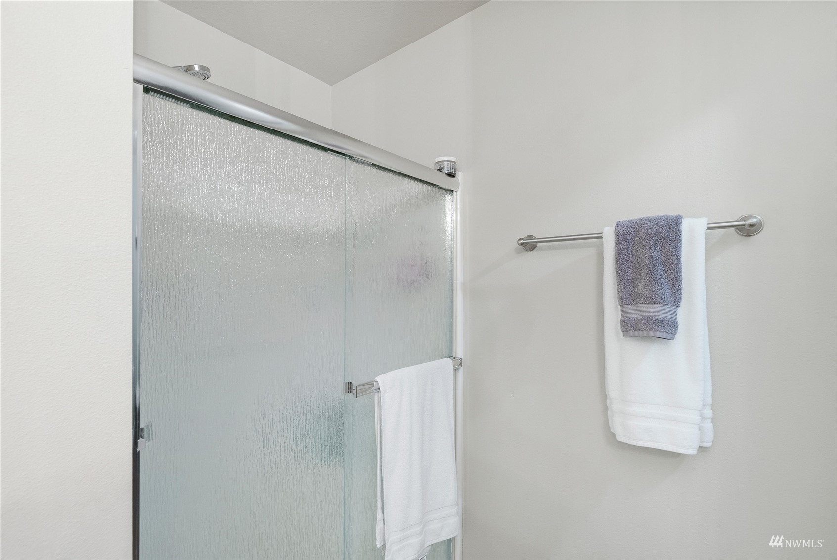 1333 Farina Loop Southeast Olympia, WA 98513 - Photo 29 of 32 a bathroom with a glass shower door