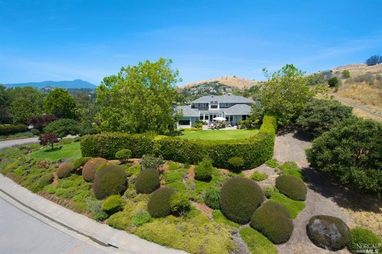 a view of a garden with a lake view