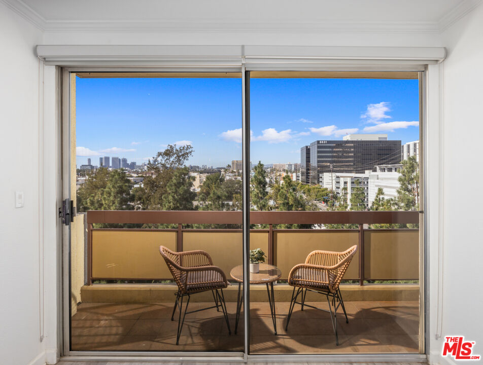 321 South San Vicente Boulevard, Unit 708 Los Angeles, CA 90048 - Photo 19 of 19 a view of a chairs and table in the balcony