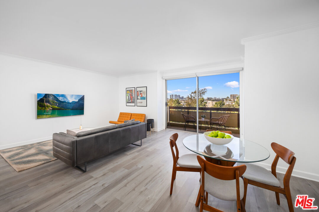 321 South San Vicente Boulevard, Unit 708 Los Angeles, CA 90048 - Photo 2 of 19 a living room with furniture and a wooden floor