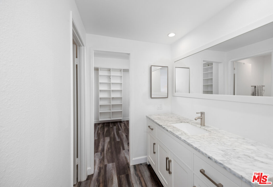 321 South San Vicente Boulevard, Unit 708 Los Angeles, CA 90048 - Photo 9 of 19 a bathroom with a sink and a mirror