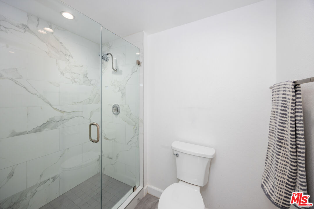 321 South San Vicente Boulevard, Unit 708 Los Angeles, CA 90048 - Photo 10 of 19 a bathroom with a shower and toilet