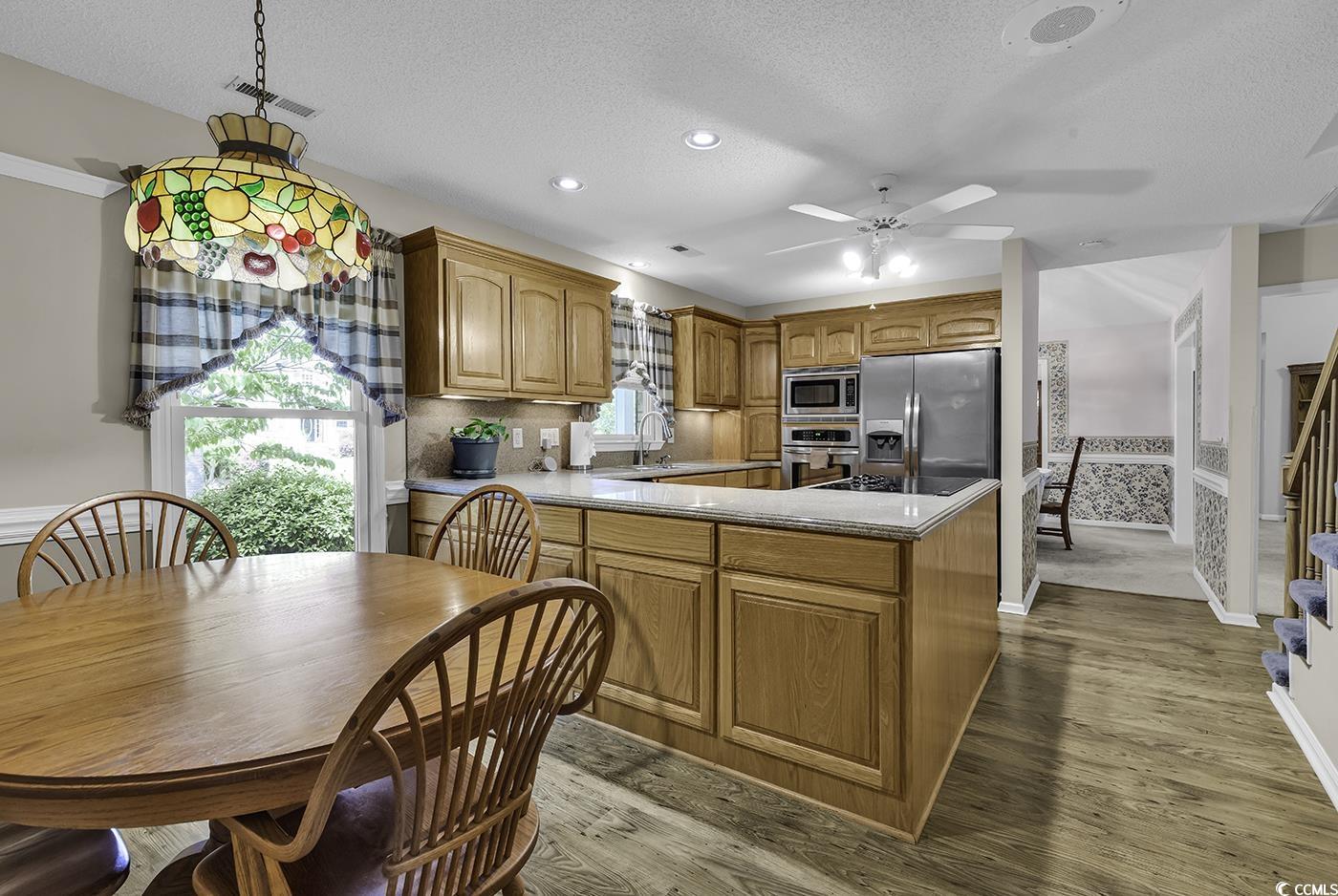 552 Enoree Court Myrtle Beach, SC 29588 - Photo 13 of 39 Eat in Kitchen with stainless steel appliances, a