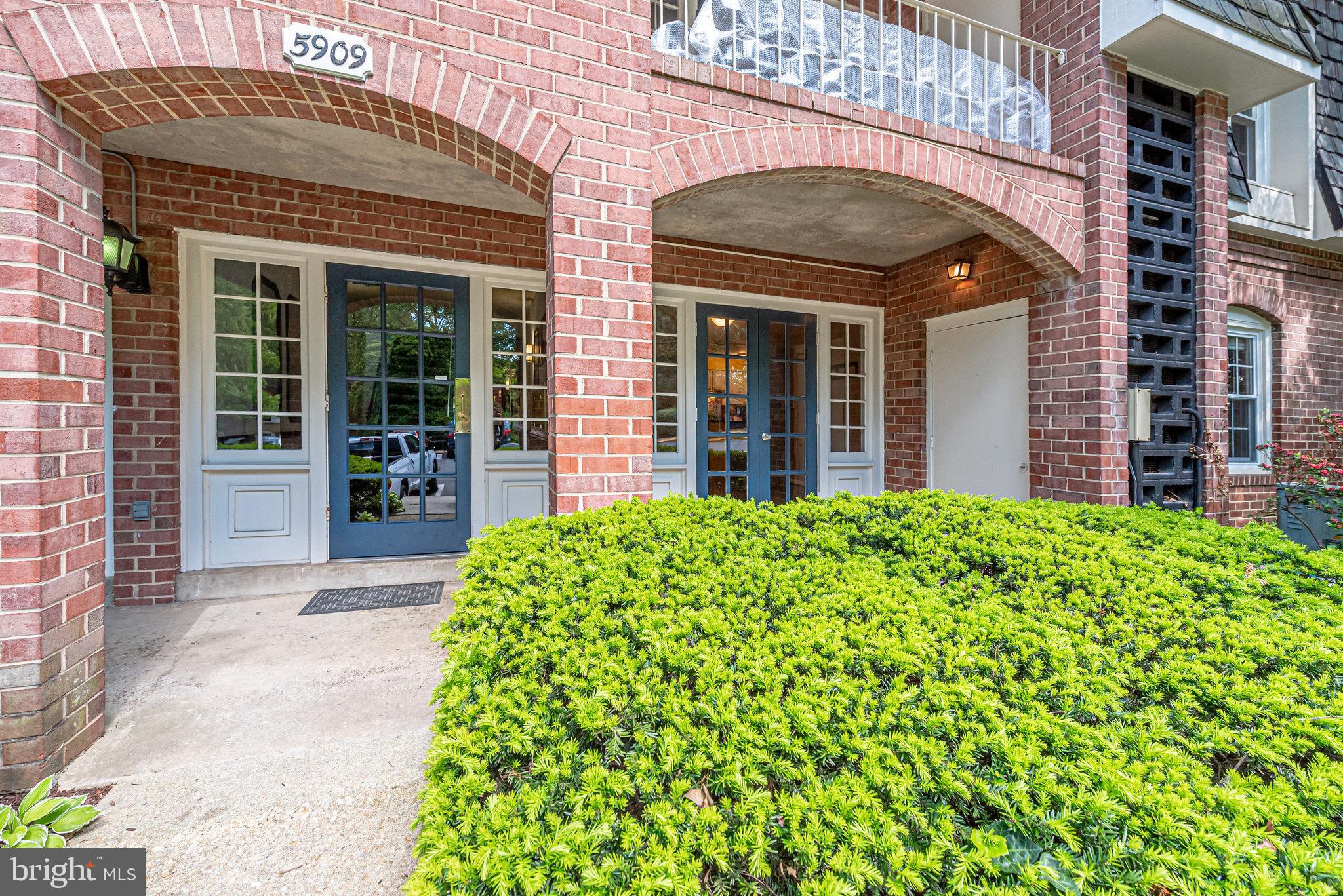 5909 B Prince James Drive, Unit B Springfield, VA 22152 - Photo 1 of 18 front view of a brick house with a large window