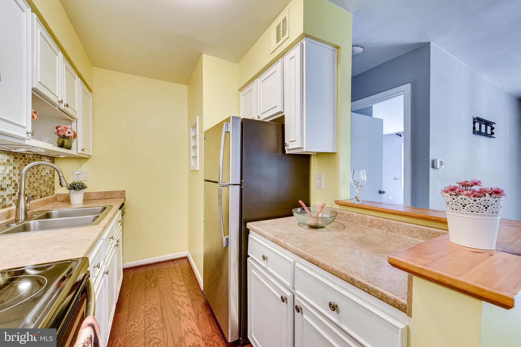 5909 B Prince James Drive, Unit B Springfield, VA 22152 - Photo 10 of 18 a bathroom with a sink and a mirror