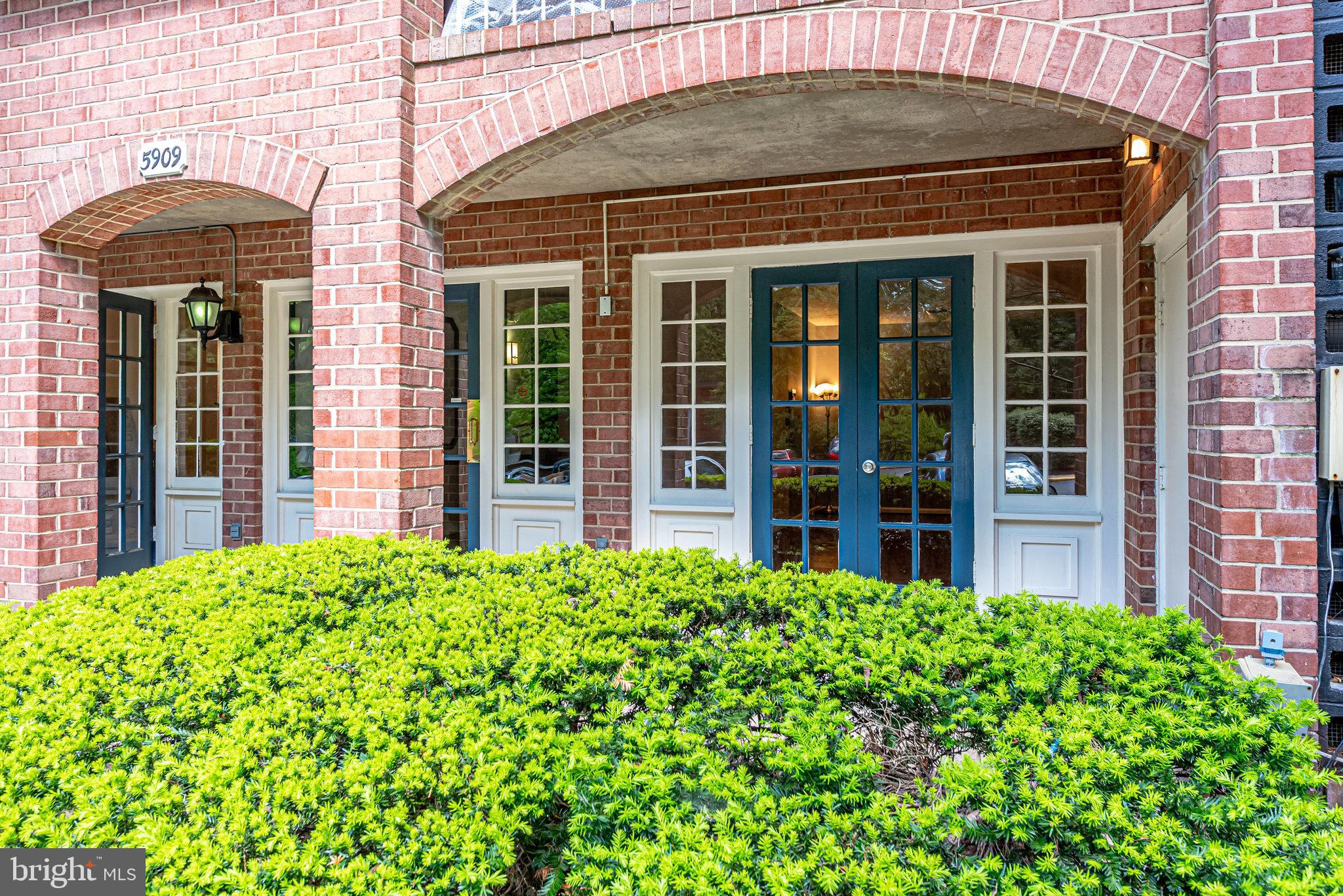 5909 B Prince James Drive, Unit B Springfield, VA 22152 - Photo 3 of 18 a front view of a house with a garden