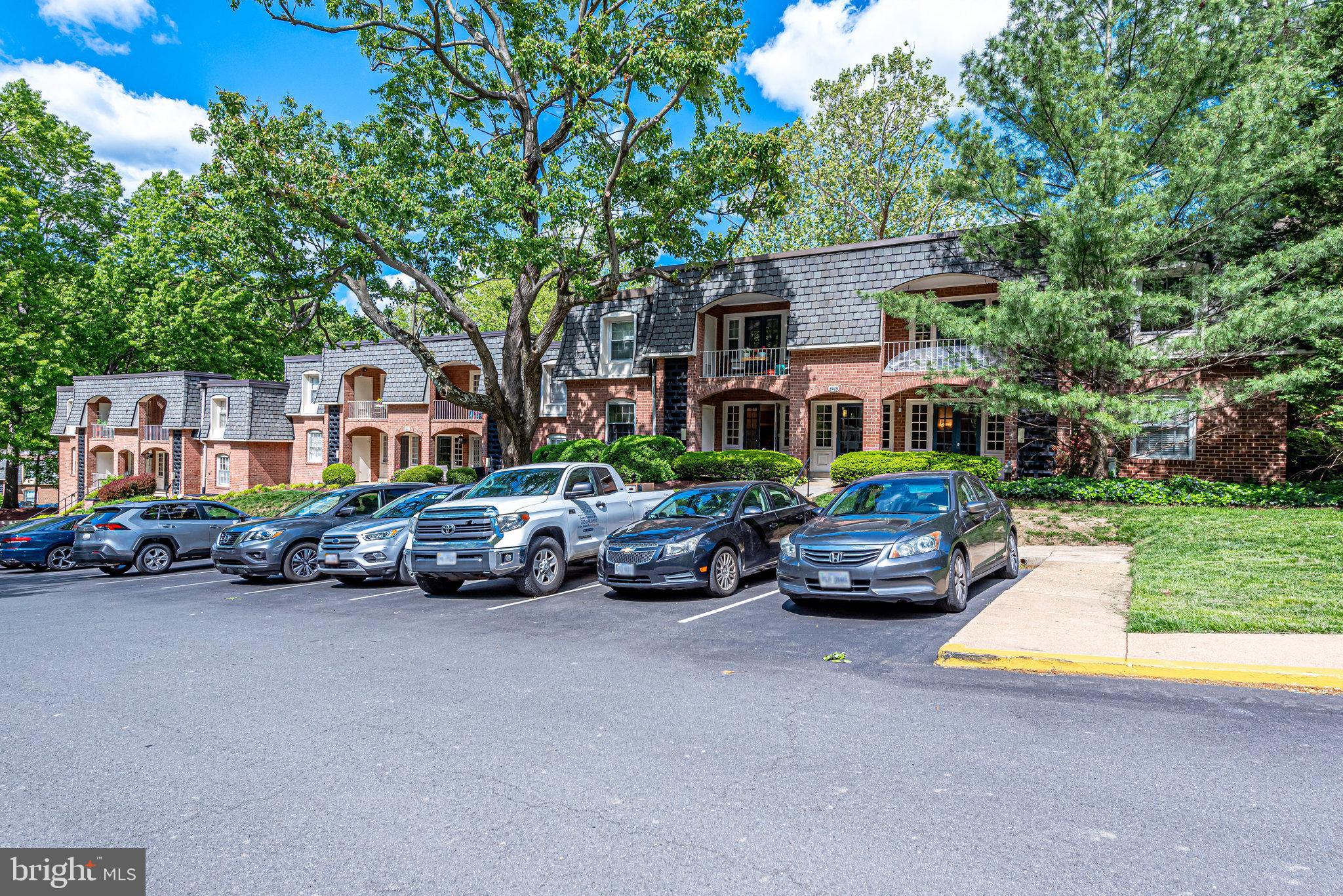 5909 B Prince James Drive, Unit B Springfield, VA 22152 - Photo 5 of 18 a view of a street with cars parked in front of the house