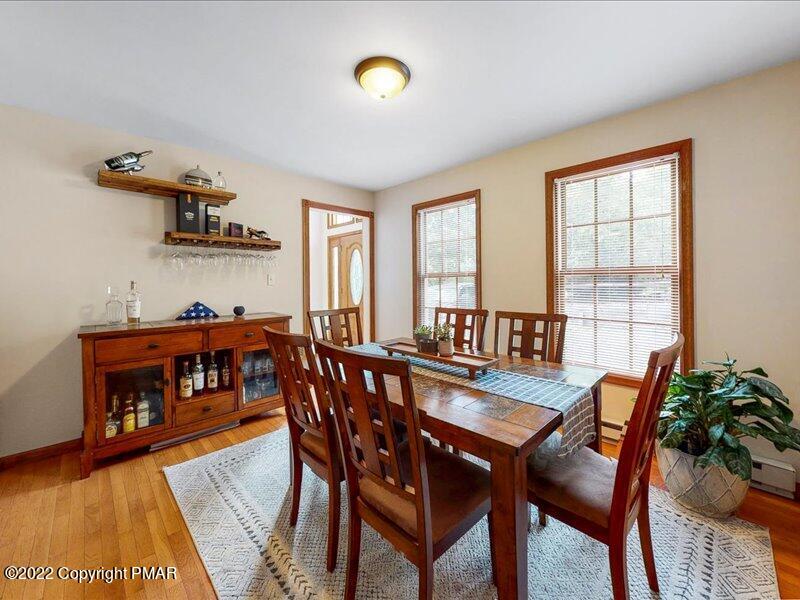1080 Hampstead Road Bushkill, PA 18324 - Photo 11 of 62 a view of a dining room with furniture and a potted plant