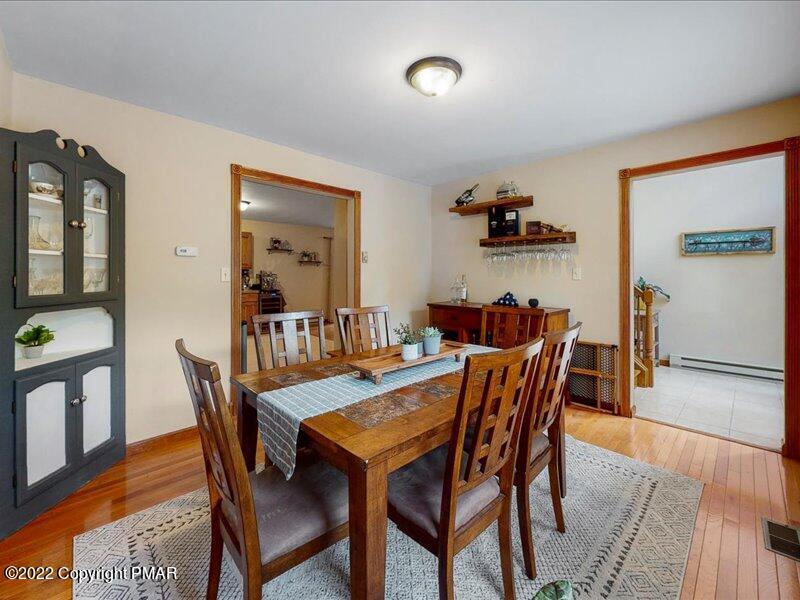 1080 Hampstead Road Bushkill, PA 18324 - Photo 12 of 62 a view of a dining room with furniture and wooden floor