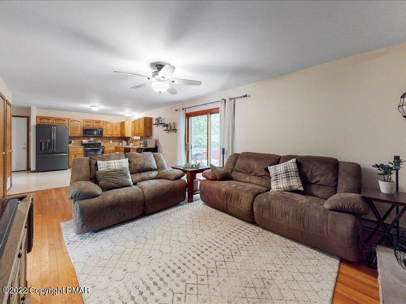 1080 Hampstead Road Bushkill, PA 18324 - Photo 16 of 62 a living room with furniture and a large window