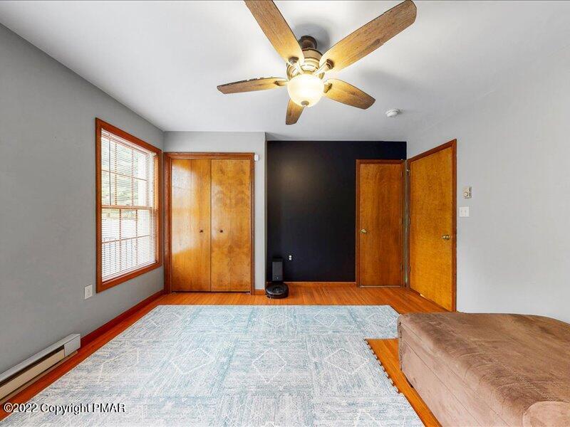 1080 Hampstead Road Bushkill, PA 18324 - Photo 19 of 62 a view of an empty room with wooden floor and a window