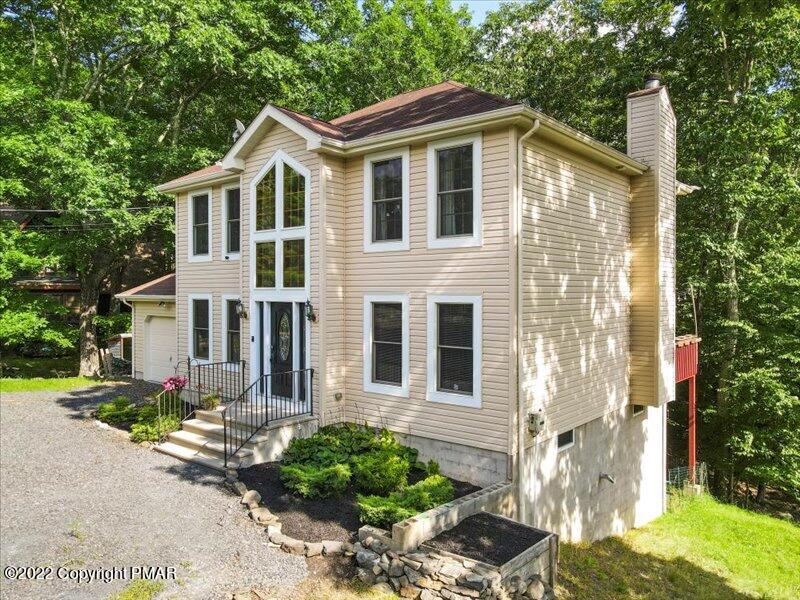 1080 Hampstead Road Bushkill, PA 18324 - Photo 2 of 62 a front view of a house with garden