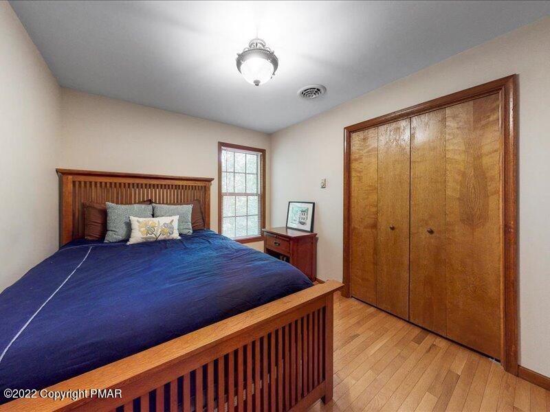 1080 Hampstead Road Bushkill, PA 18324 - Photo 34 of 62 a bedroom with a bed and a window
