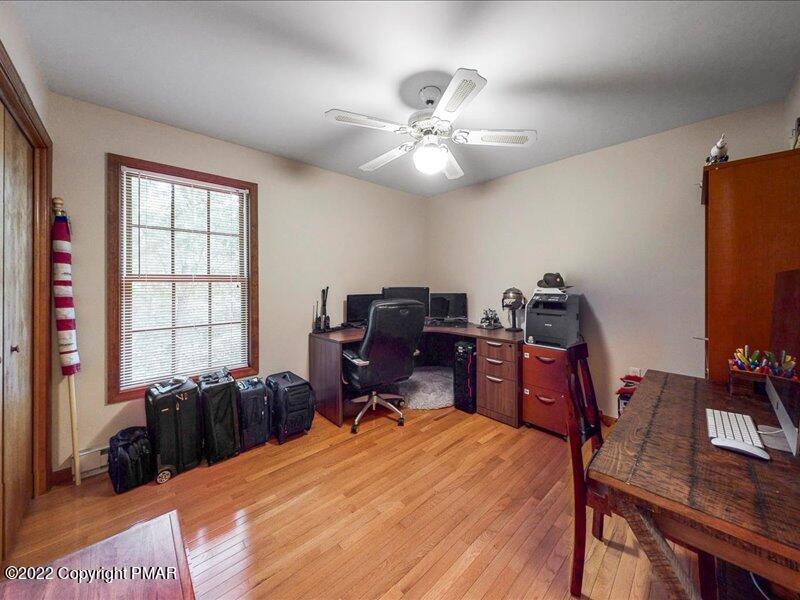 1080 Hampstead Road Bushkill, PA 18324 - Photo 35 of 62 a bed room with a bed and a desk