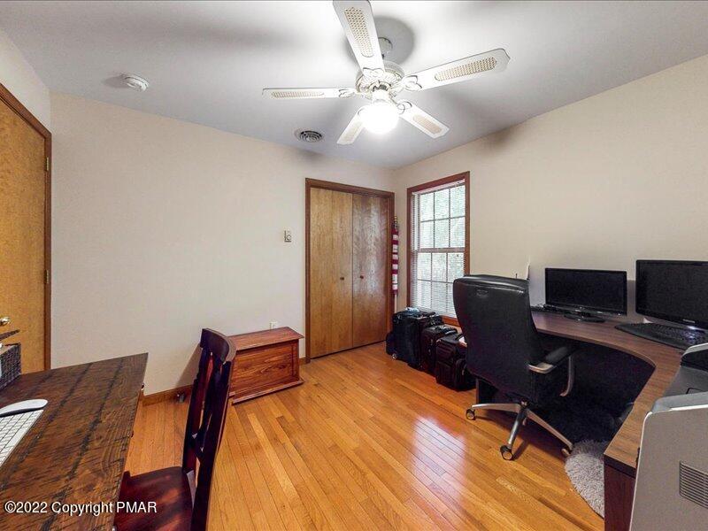 1080 Hampstead Road Bushkill, PA 18324 - Photo 36 of 62 a workspace with furniture and wooden floor