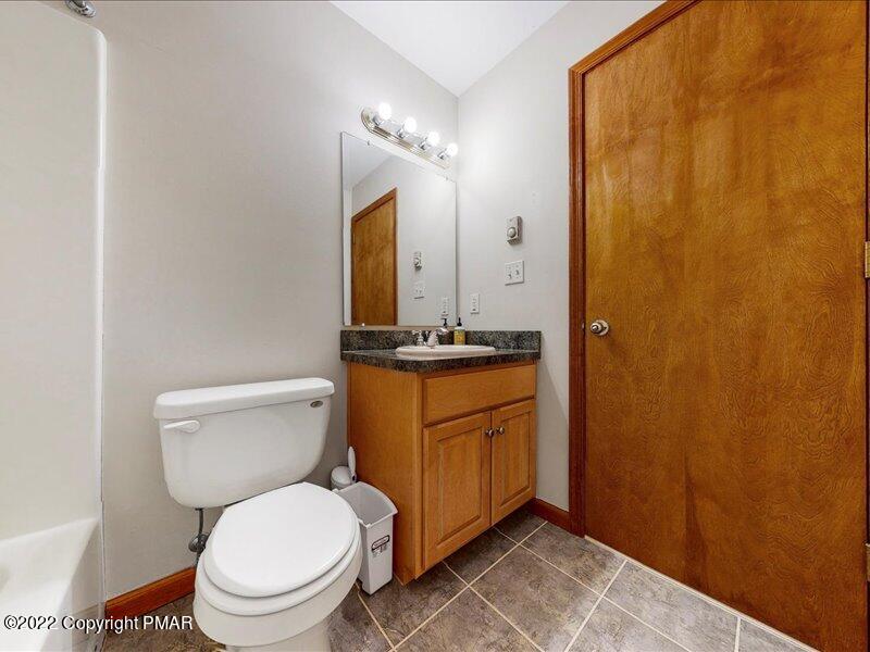 1080 Hampstead Road Bushkill, PA 18324 - Photo 39 of 62 a bathroom with a granite countertop toilet sink and mirror