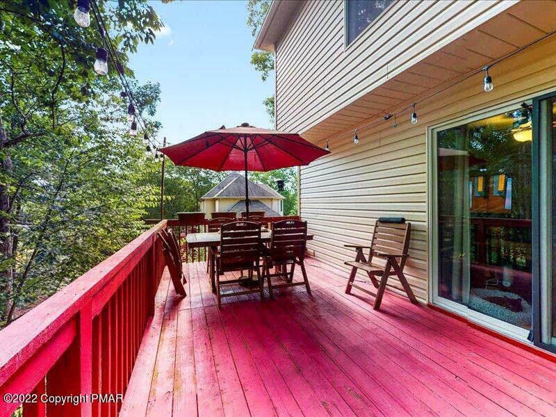 1080 Hampstead Road Bushkill, PA 18324 - Photo 41 of 62 a view of balcony with chairs and wooden floor