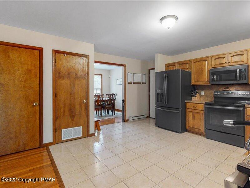 1080 Hampstead Road Bushkill, PA 18324 - Photo 10 of 62 a kitchen with stainless steel appliances a refrigerator and a stove top oven