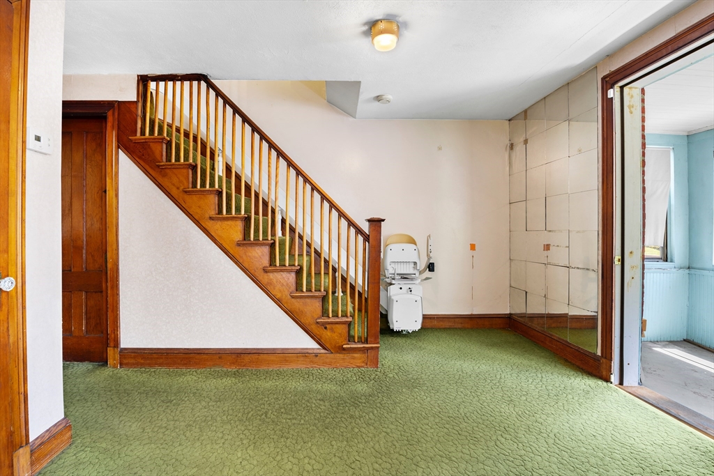 27 Colorado Street Boston, MA 02126 - Photo 15 of 32 a view of an empty room with stairs