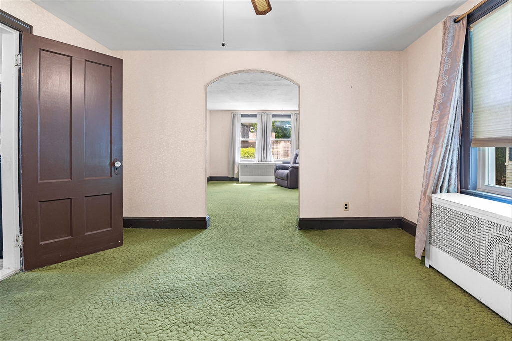 27 Colorado Street Boston, MA 02126 - Photo 18 of 32 a view of an empty room with cabinet and a window