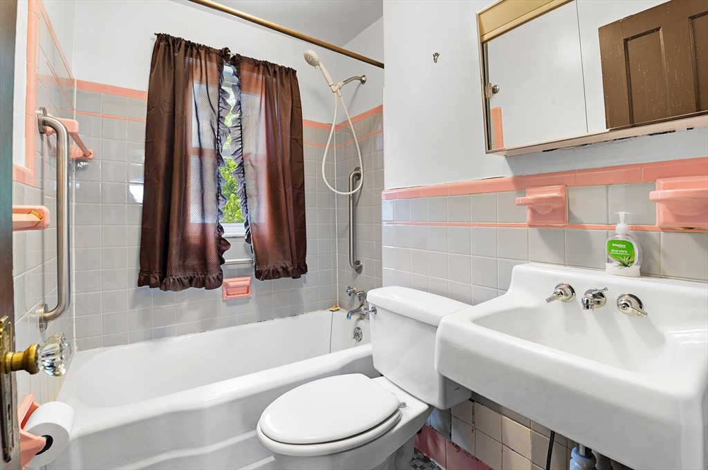 27 Colorado Street Boston, MA 02126 - Photo 22 of 32 a bathroom with a sink a toilet and a bathtub