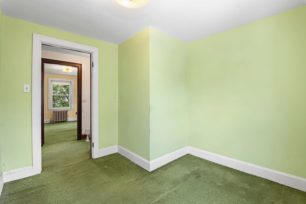 27 Colorado Street Boston, MA 02126 - Photo 25 of 32 a view of an empty room and closet area
