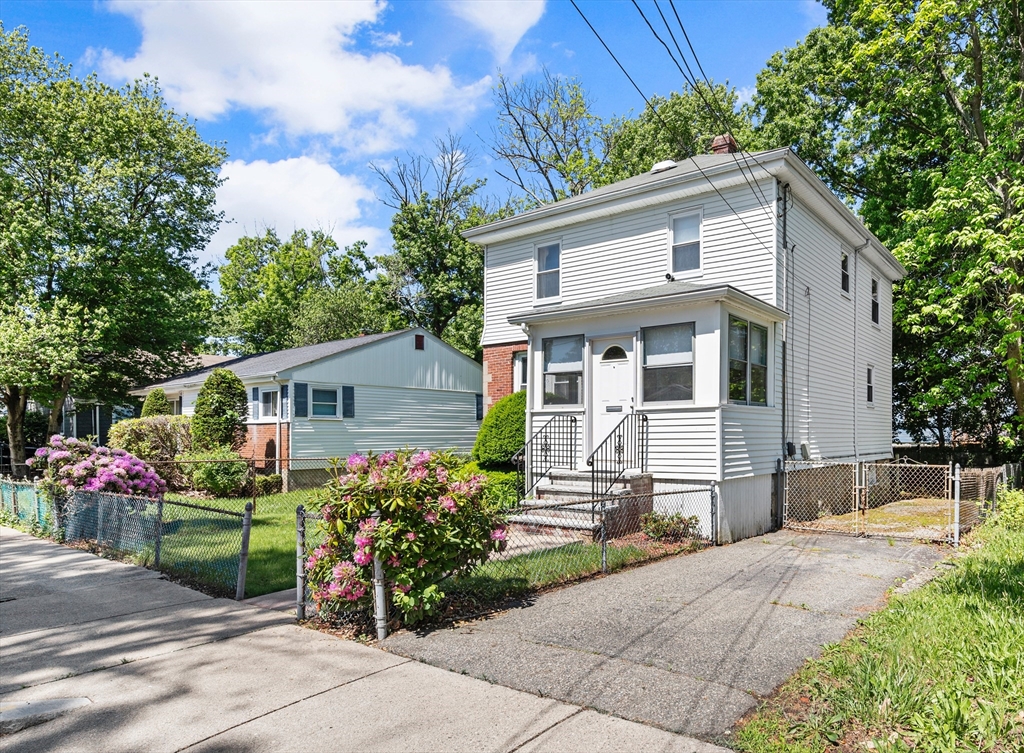 27 Colorado Street Boston, MA 02126 - Photo 3 of 32 a front view of a house with a garden