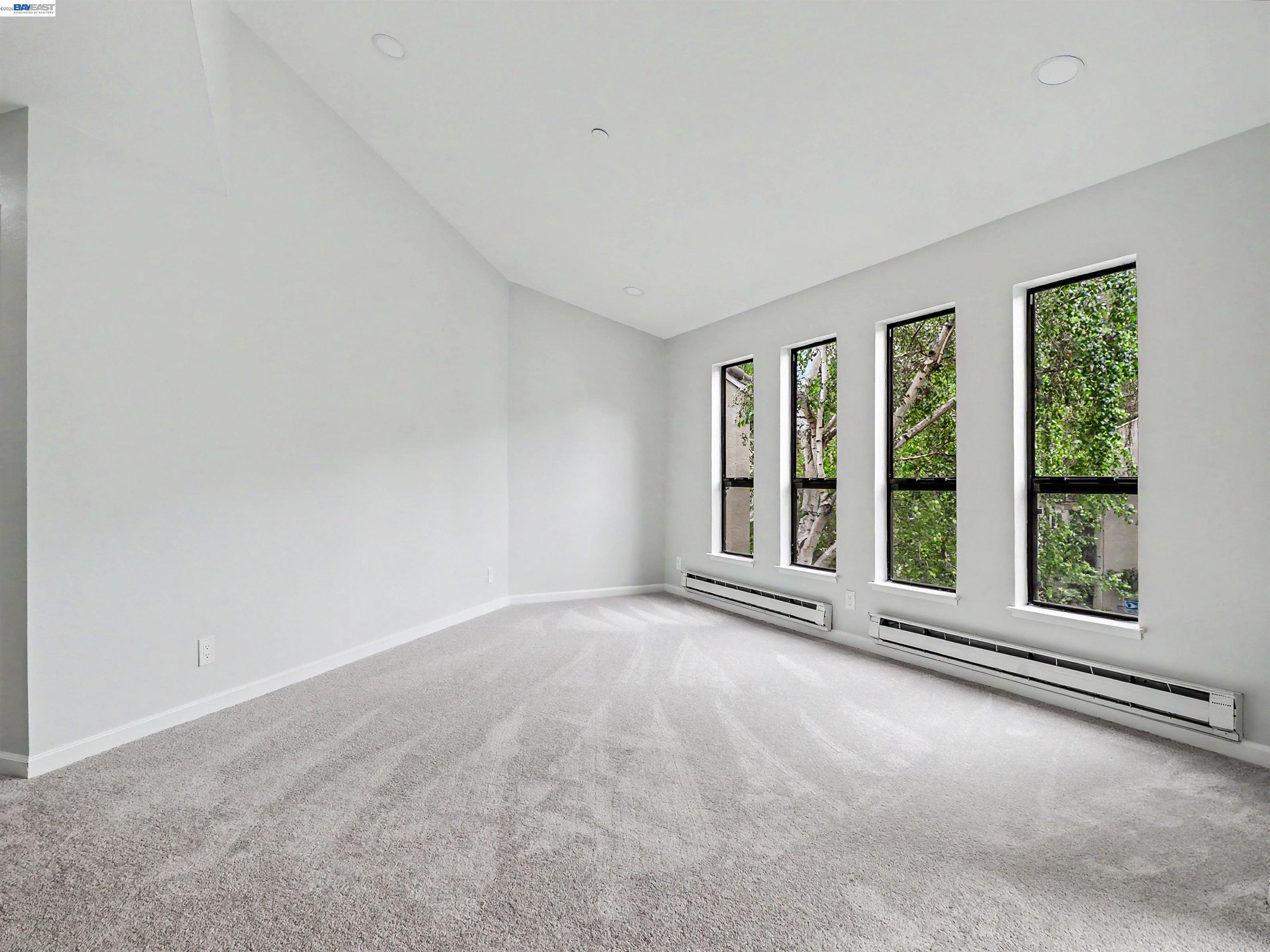 39450 Albany Common, Unit X Fremont, CA 94538 - Photo 2 of 46 an empty room with windows and view