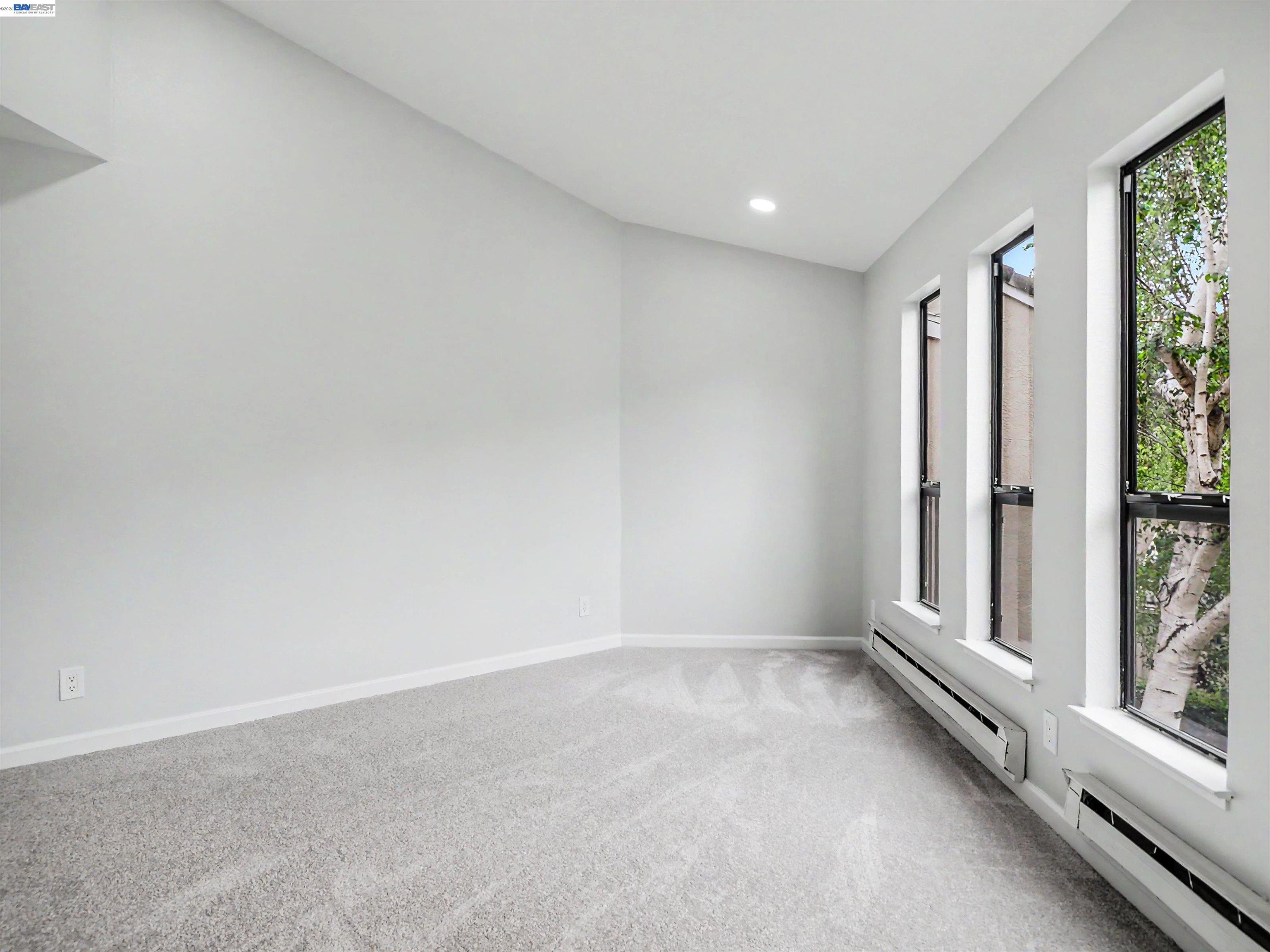 39450 Albany Common, Unit X Fremont, CA 94538 - Photo 21 of 46 a view of an empty room with a window