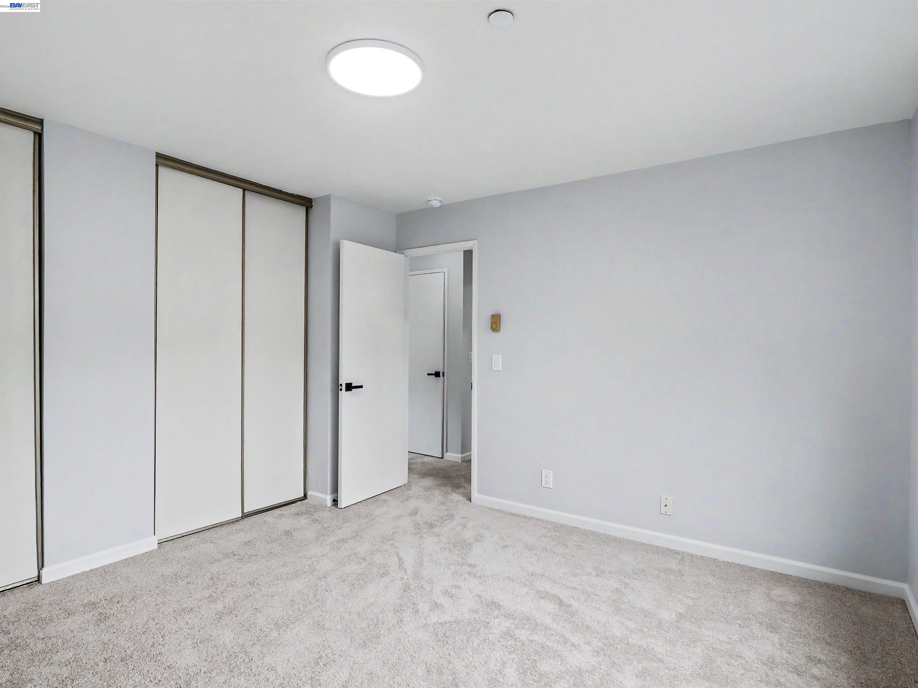39450 Albany Common, Unit X Fremont, CA 94538 - Photo 30 of 46 an empty room with closet area