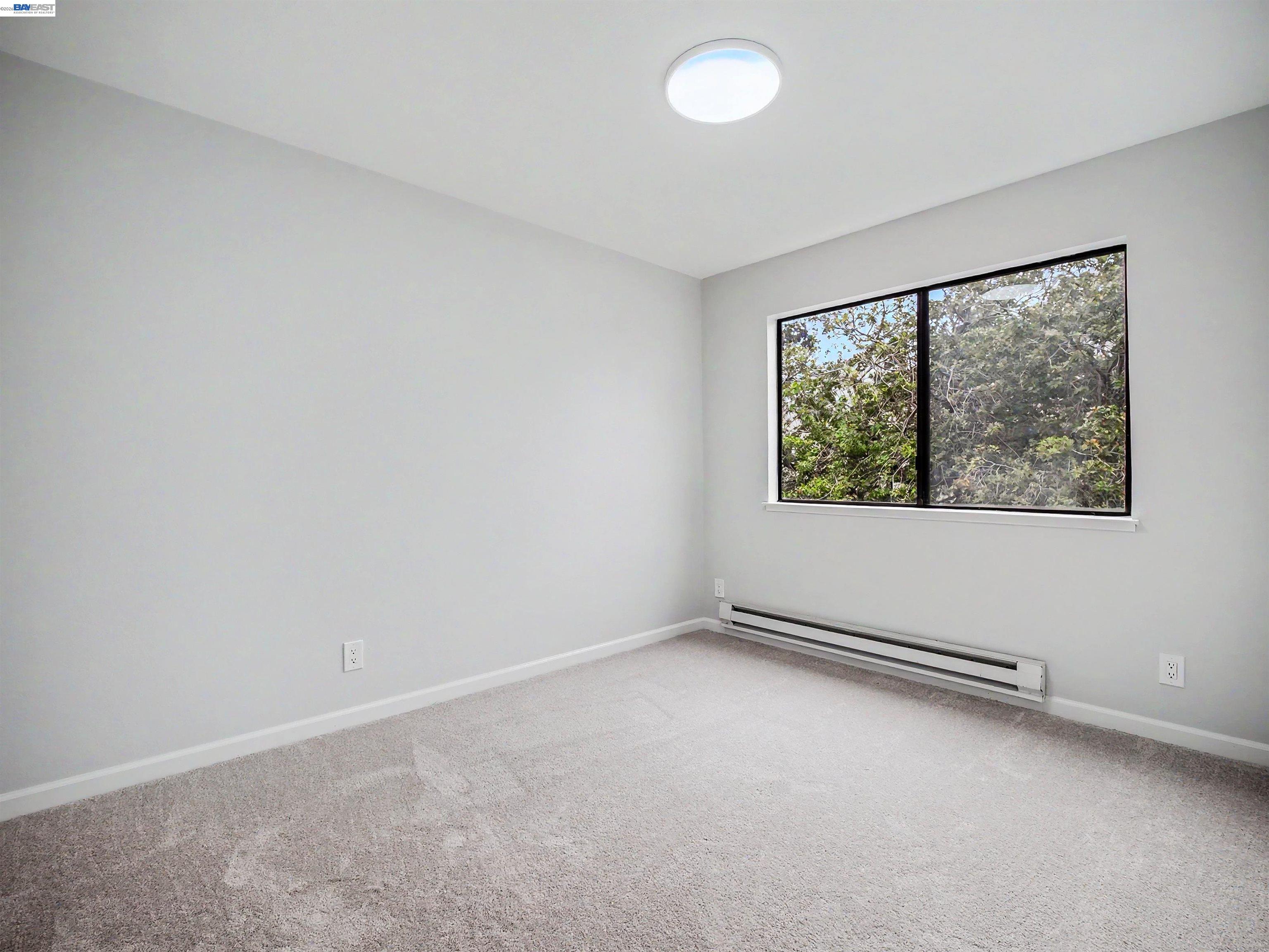 39450 Albany Common, Unit X Fremont, CA 94538 - Photo 32 of 46 an empty room with a window