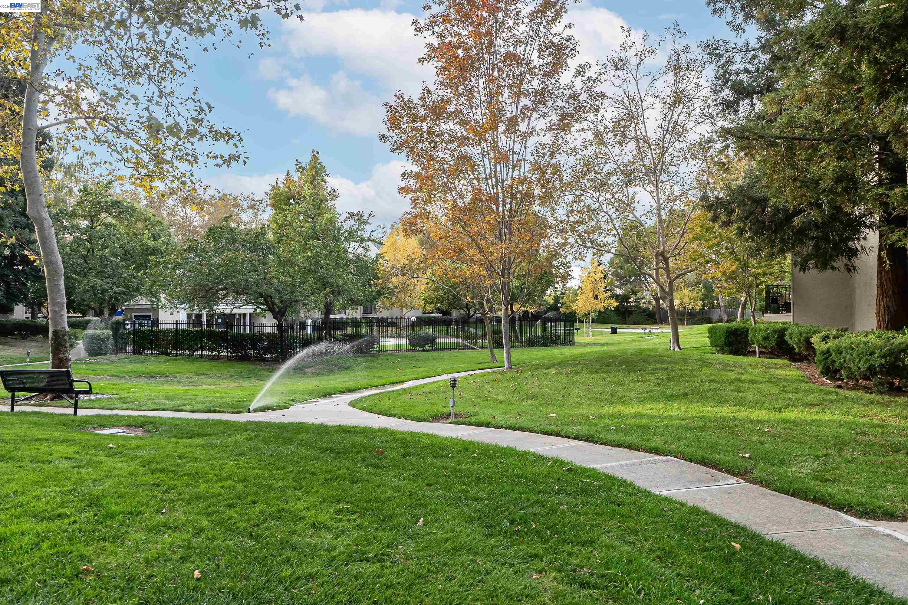 39450 Albany Common, Unit X Fremont, CA 94538 - Photo 35 of 46 a view of a park with kids park